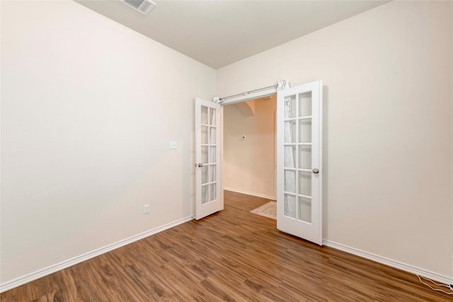 228 Durata Dr, San Marcos, TX 78666 - empty room with french doors and wood finished floors