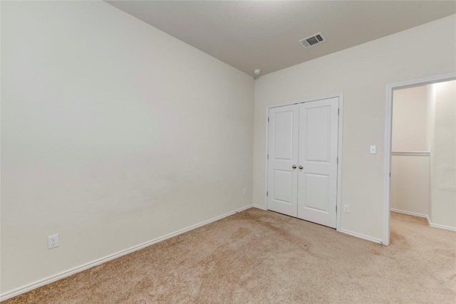 228 Durata Dr, San Marcos, TX 78666 - unfurnished bedroom featuring light colored carpet and a closet