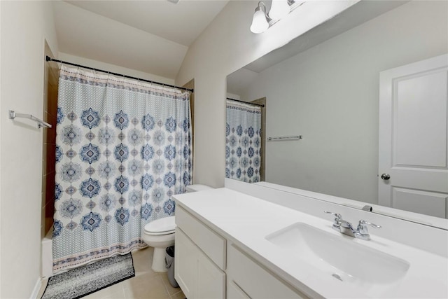 full bathroom featuring tile patterned floors, vaulted ceiling, toilet, shower / bath combo with shower curtain, and vanity