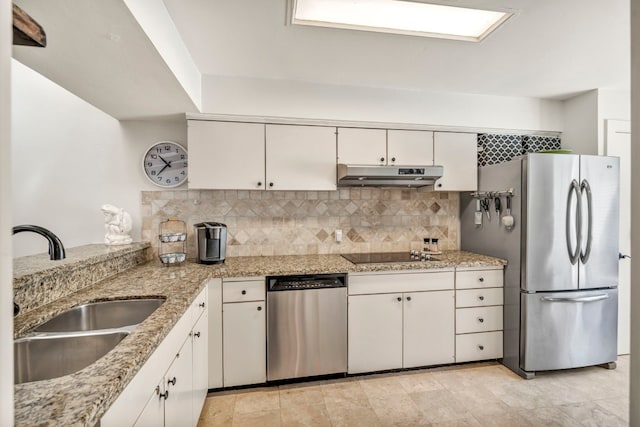 kitchen featuring sink, light tile floors, tasteful backsplash, and appliances with stainless steel finishes