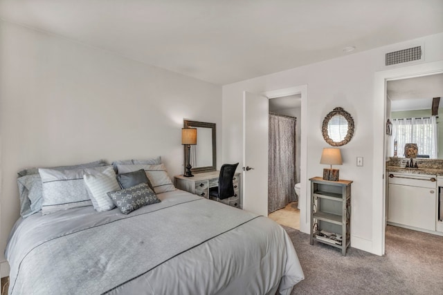 bedroom featuring carpet floors and ensuite bathroom