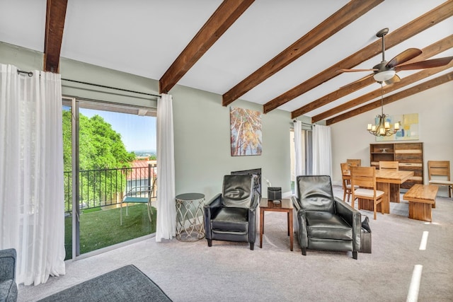 sitting room with lofted ceiling with beams, carpet floors, and ceiling fan with notable chandelier