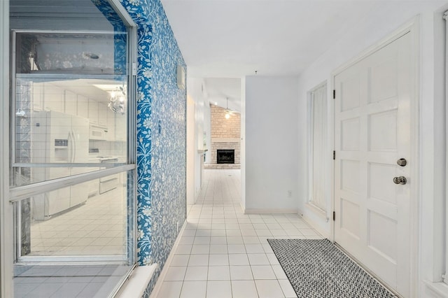 bathroom featuring a fireplace and tile patterned flooring