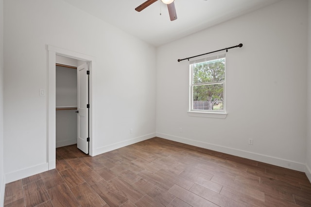 spare room featuring hardwood / wood-style flooring and ceiling fan