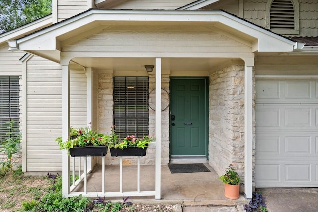 view of exterior entry featuring a garage