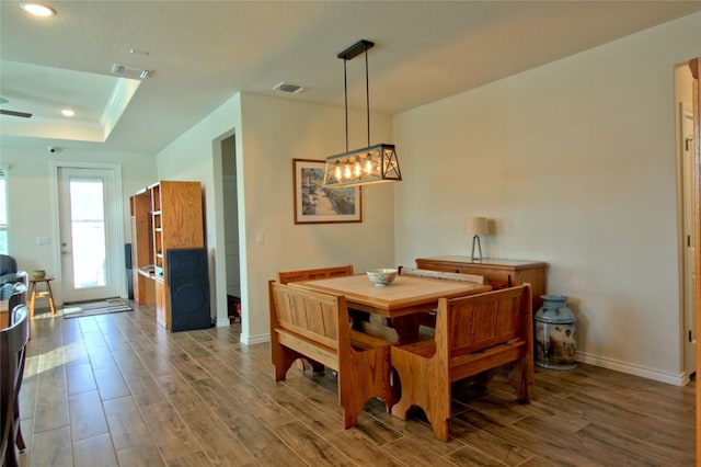 dining room featuring a tray ceiling