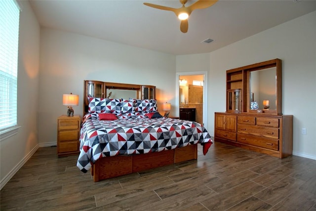 bedroom with ensuite bath and ceiling fan