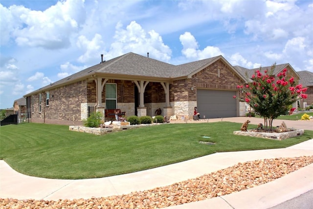 view of front of home with a garage and a front lawn