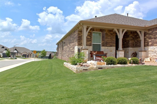 view of side of home featuring a yard