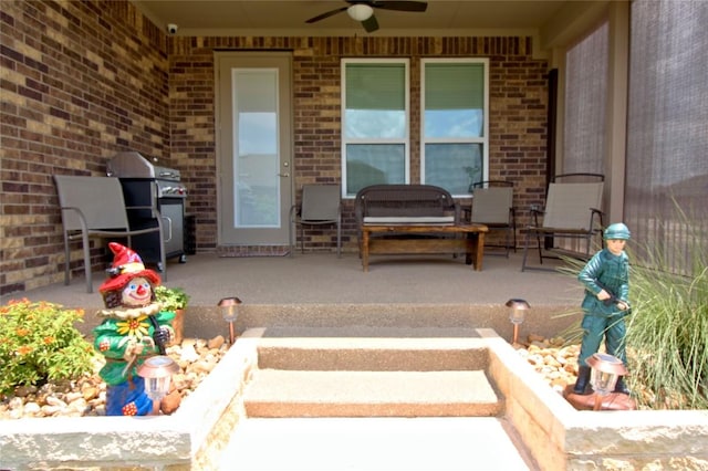 view of patio featuring a grill and ceiling fan