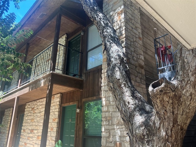 view of home's exterior with a balcony