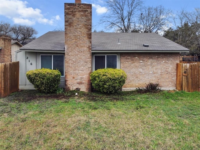 view of side of property with a lawn