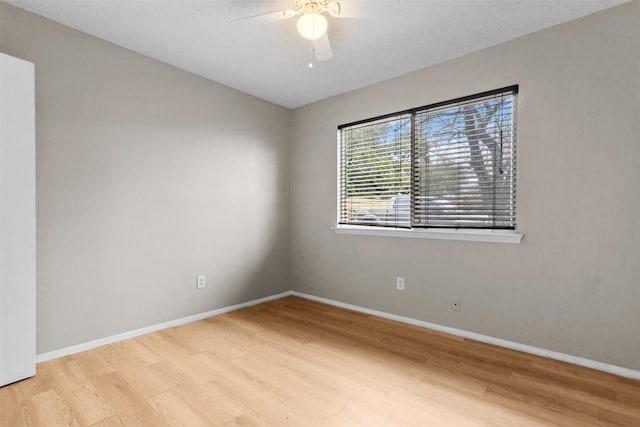 empty room featuring light hardwood / wood-style flooring and ceiling fan