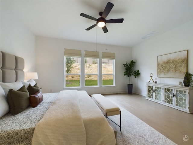 bedroom featuring light hardwood / wood-style floors and ceiling fan