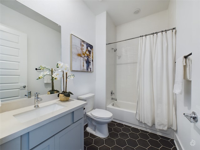 full bathroom with shower / bath combo, toilet, and vanity