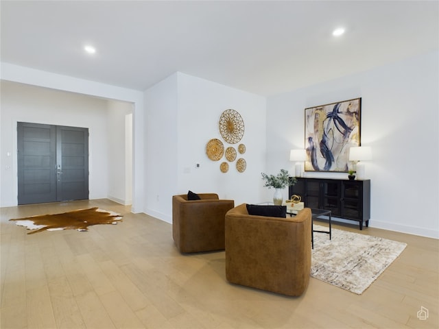 living room with light hardwood / wood-style flooring