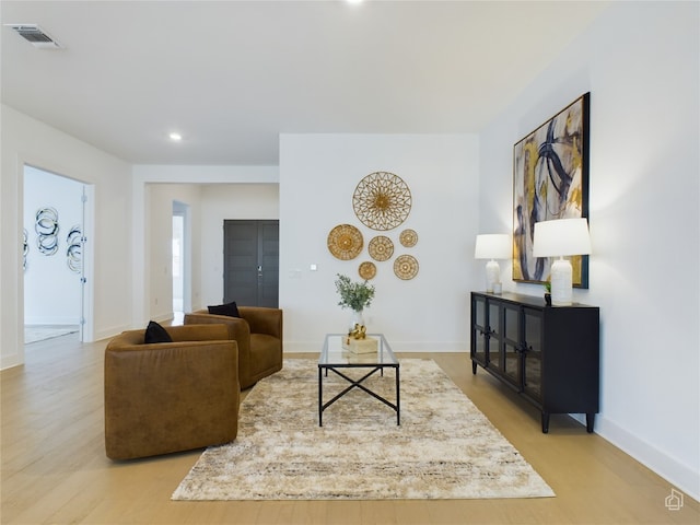 living room with light hardwood / wood-style flooring