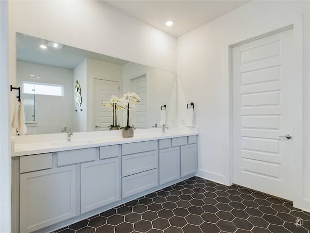 bathroom featuring a shower and vanity