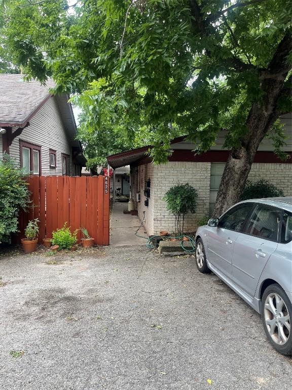 view of property exterior with a carport