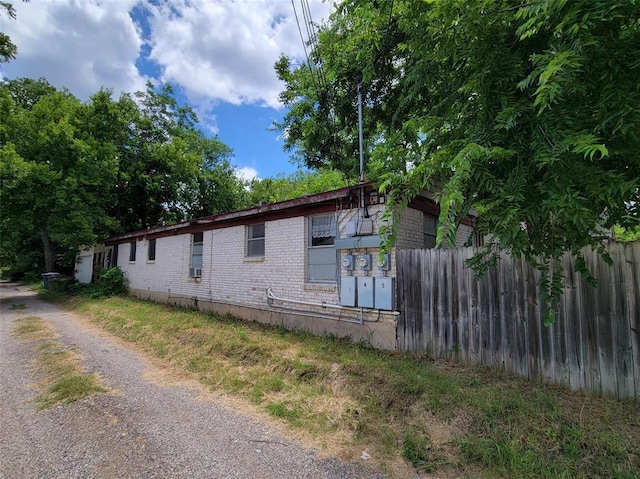 4627 Depew Ave, Austin, TX 78751 - view of side of property featuring driveway and brick siding