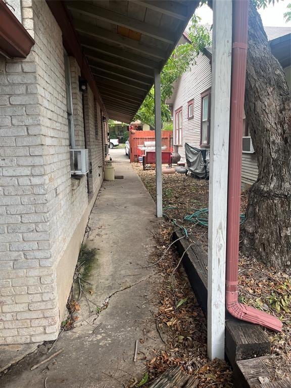 4627 Depew Ave, Austin, TX 78751 - view of side of property featuring brick siding and cooling unit
