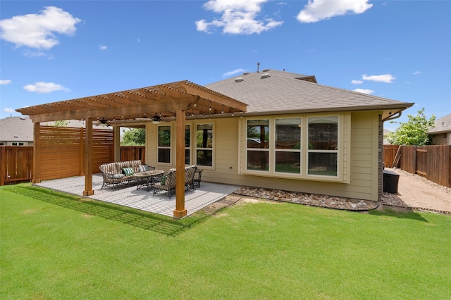 rear view of house with a pergola, a yard, and a patio