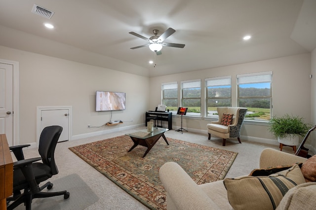 carpeted home office with ceiling fan