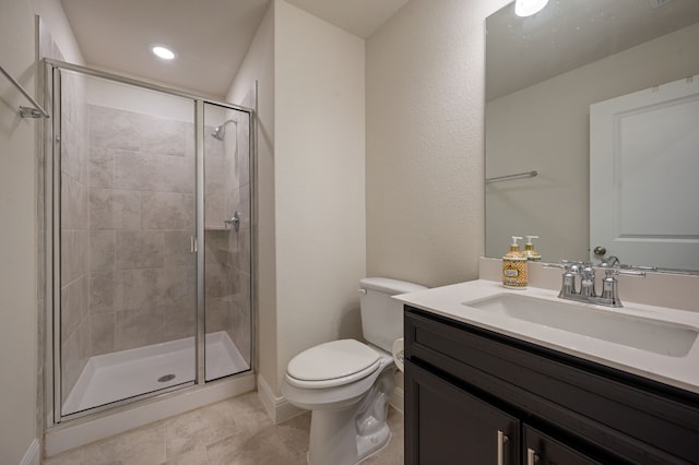 bathroom with walk in shower, vanity, and toilet