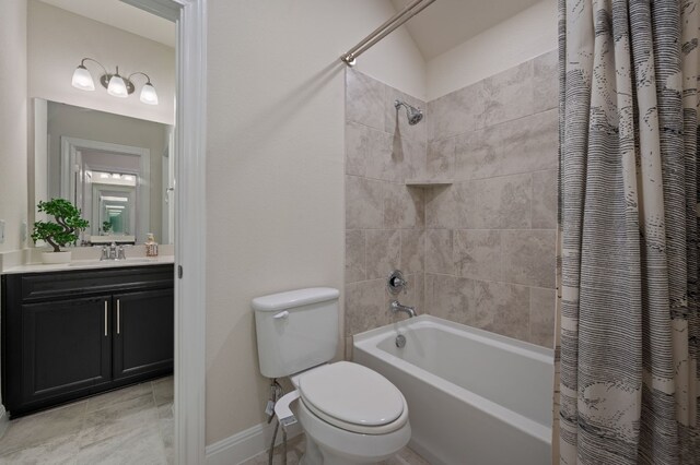 full bathroom featuring shower / bath combo with shower curtain, vanity, and toilet