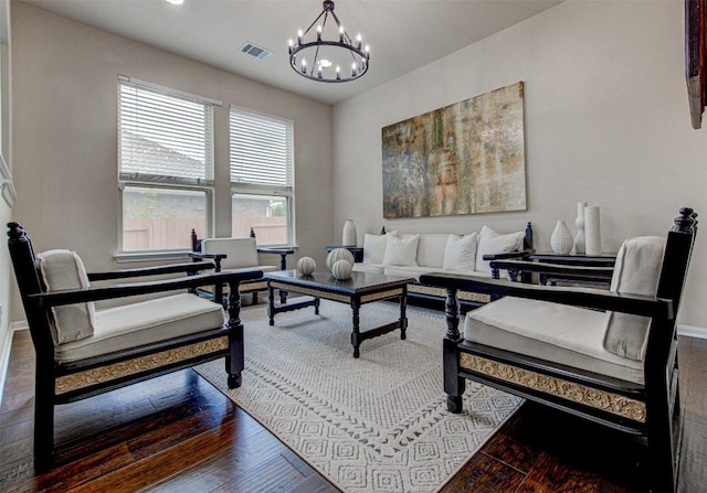3113 Pasqueflower Pass, Pflugerville, TX 78660 - living room featuring a chandelier, wood finished floors, and baseboards