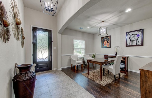 3113 Pasqueflower Pass, Pflugerville, TX 78660 - entrance foyer featuring a chandelier, arched walkways, baseboards, recessed lighting, and wood finished floors