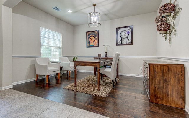 office space with hardwood / wood-style flooring and a notable chandelier