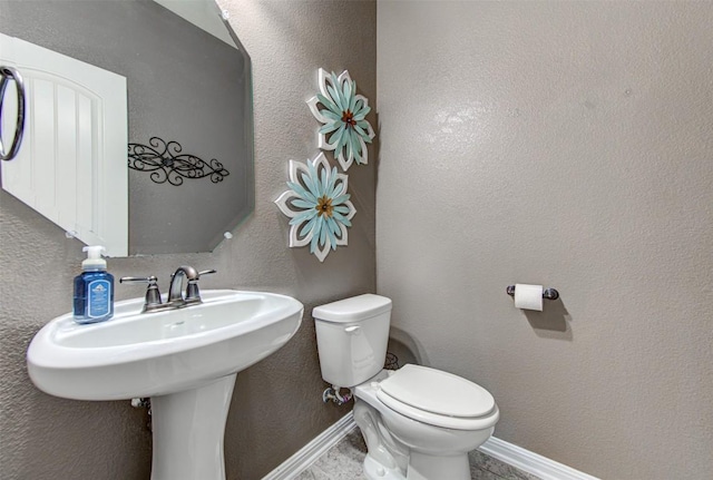 3113 Pasqueflower Pass, Pflugerville, TX 78660 - bathroom with toilet, baseboards, and a sink