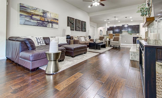 3113 Pasqueflower Pass, Pflugerville, TX 78660 - living room featuring a ceiling fan, dark wood-type flooring, arched walkways, recessed lighting, and baseboards