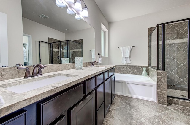 3113 Pasqueflower Pass, Pflugerville, TX 78660 - bathroom featuring a stall shower, double vanity, and a garden tub