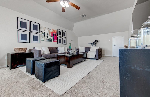 living room with carpet flooring, ceiling fan, and vaulted ceiling