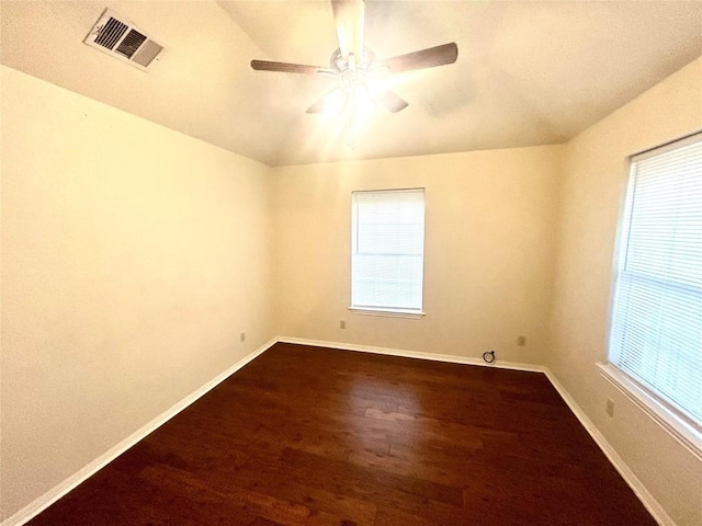 unfurnished room with ceiling fan, wood-type flooring, and lofted ceiling