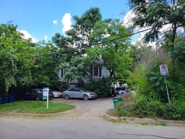 view of property hidden behind natural elements