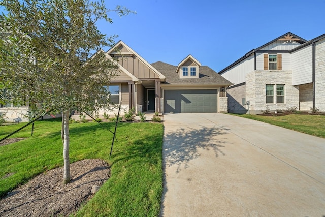 craftsman house with a front yard and a garage