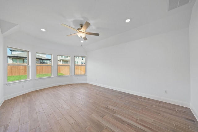 spare room with ceiling fan and light wood-type flooring