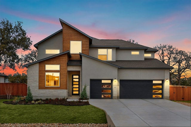 modern home with a yard and a garage