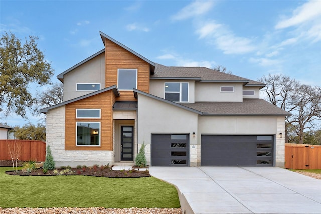 view of front of property with a garage and a front yard