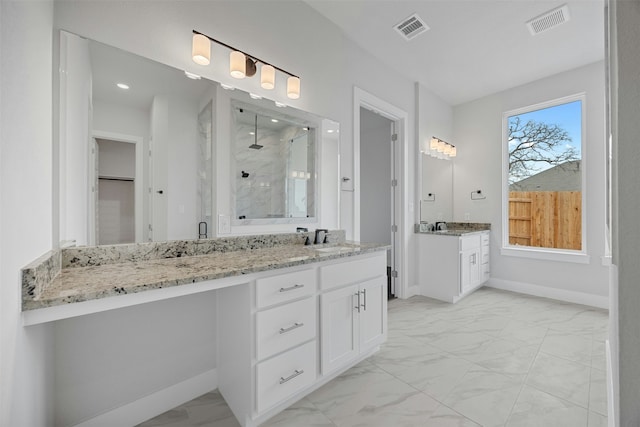 bathroom with vanity and an enclosed shower