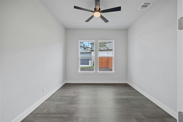 unfurnished room with ceiling fan and dark hardwood / wood-style flooring