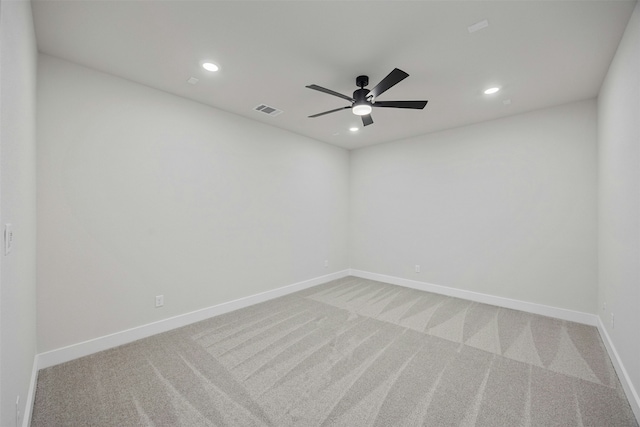 empty room with ceiling fan and carpet