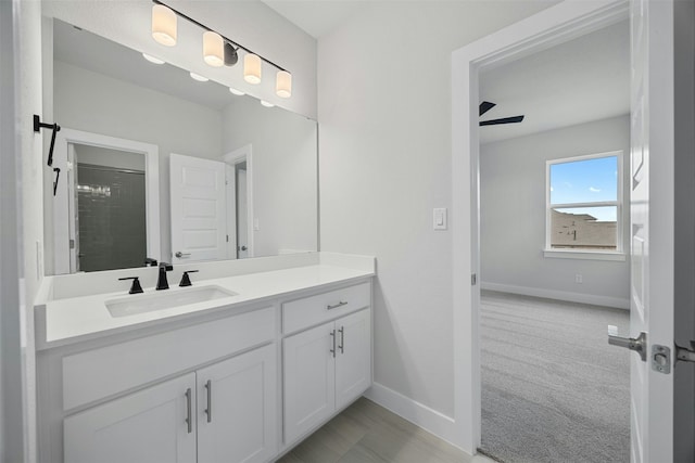 bathroom featuring vanity and a shower