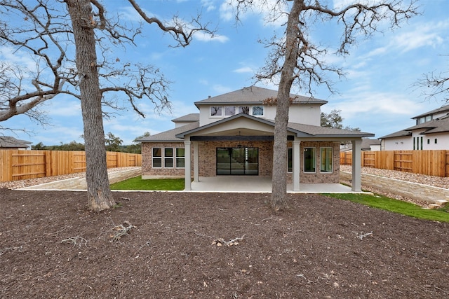 rear view of house featuring a patio