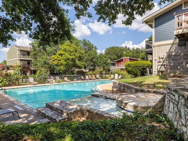 view of swimming pool with a patio