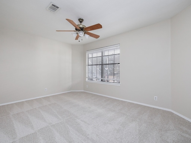 spare room with light carpet and ceiling fan