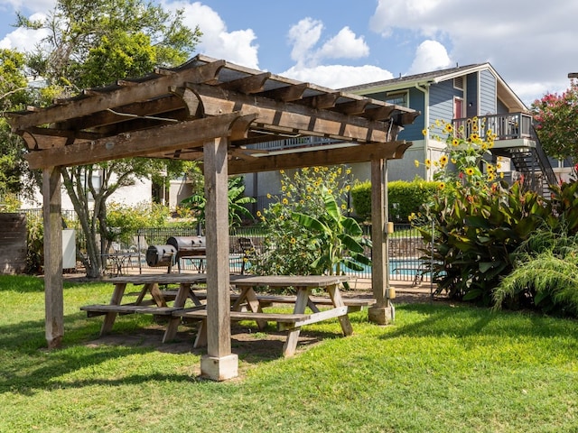 surrounding community with a pergola and a lawn